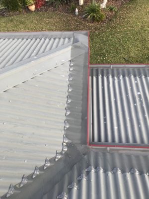 Corrugated roof gutter guard